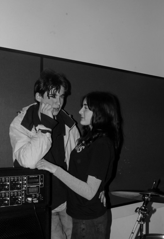 April Smith and Lucien Lapthorn standing together beside musical equipment